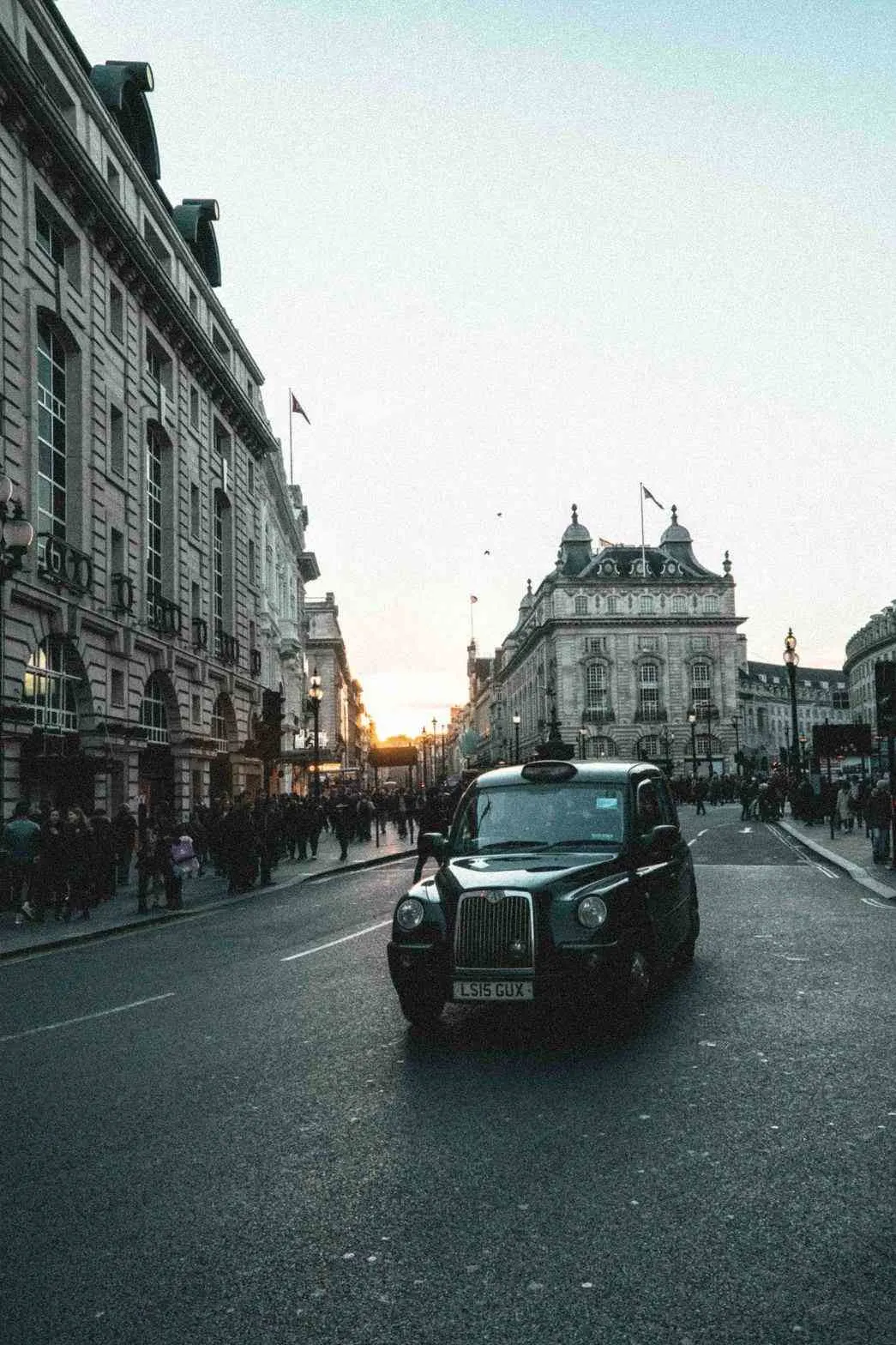 Classic shot of Piccadilly circus with Black Cab.