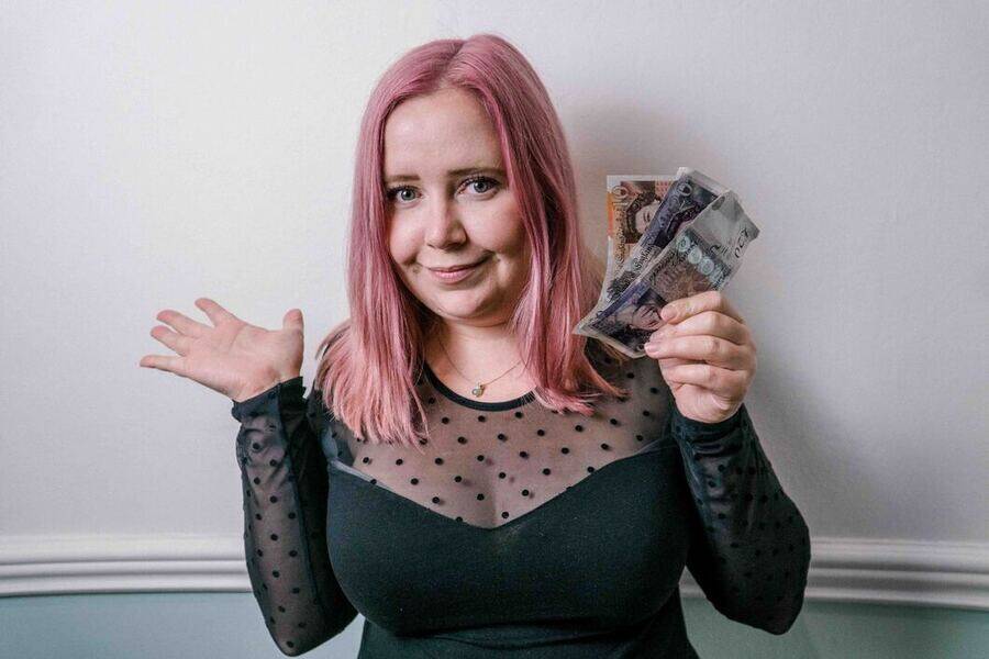 Kat holding British Pounds