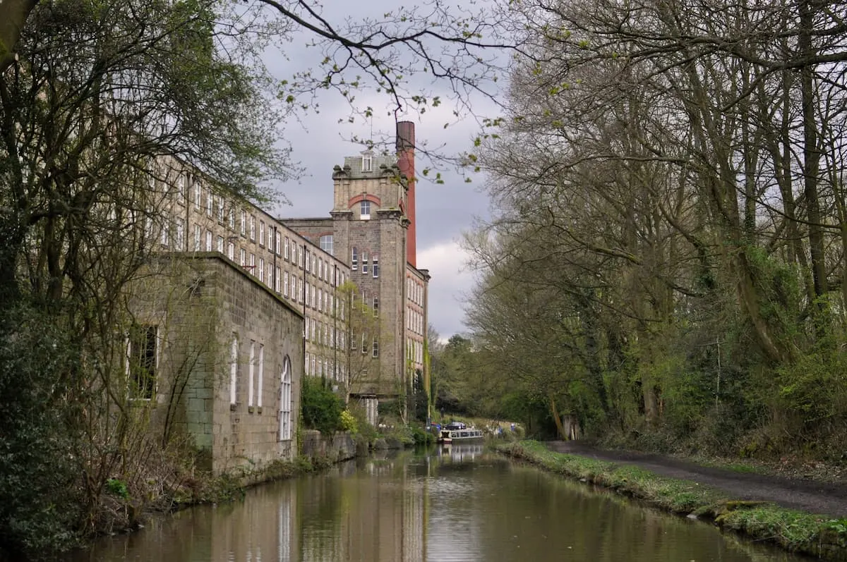 An old factory on the banks of the canal near Bollington in Cheshire