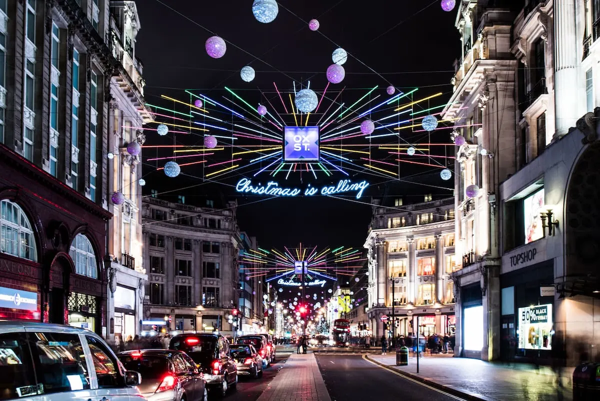 Christmas lights in London Oxford street with cars in traffic 