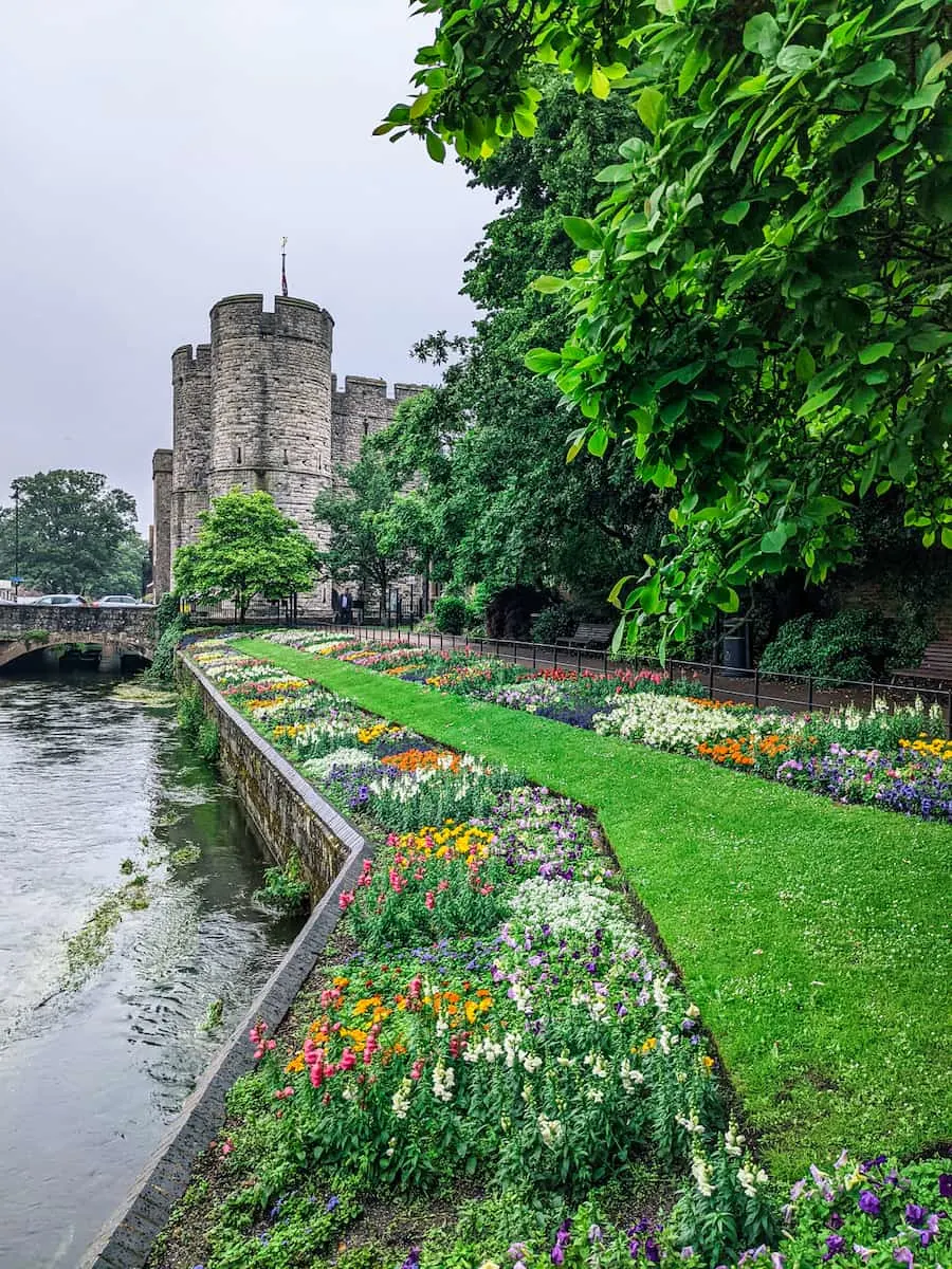 The Westgate in Canterbury with Gardens and river in front