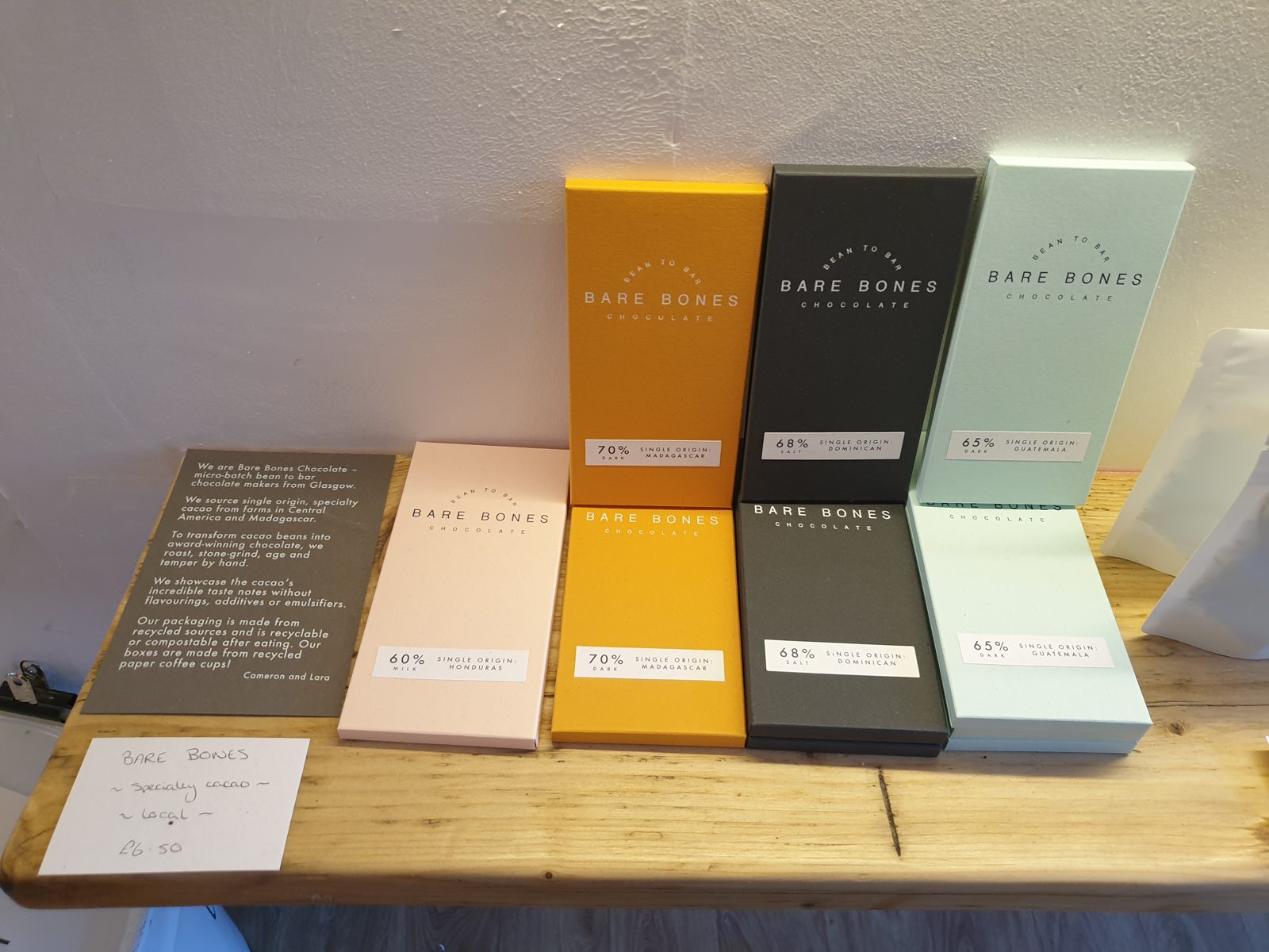 Single origin Bare Bones chocolate bars from Glasgow on a shop shelf in Stirling, priced at £6.50.