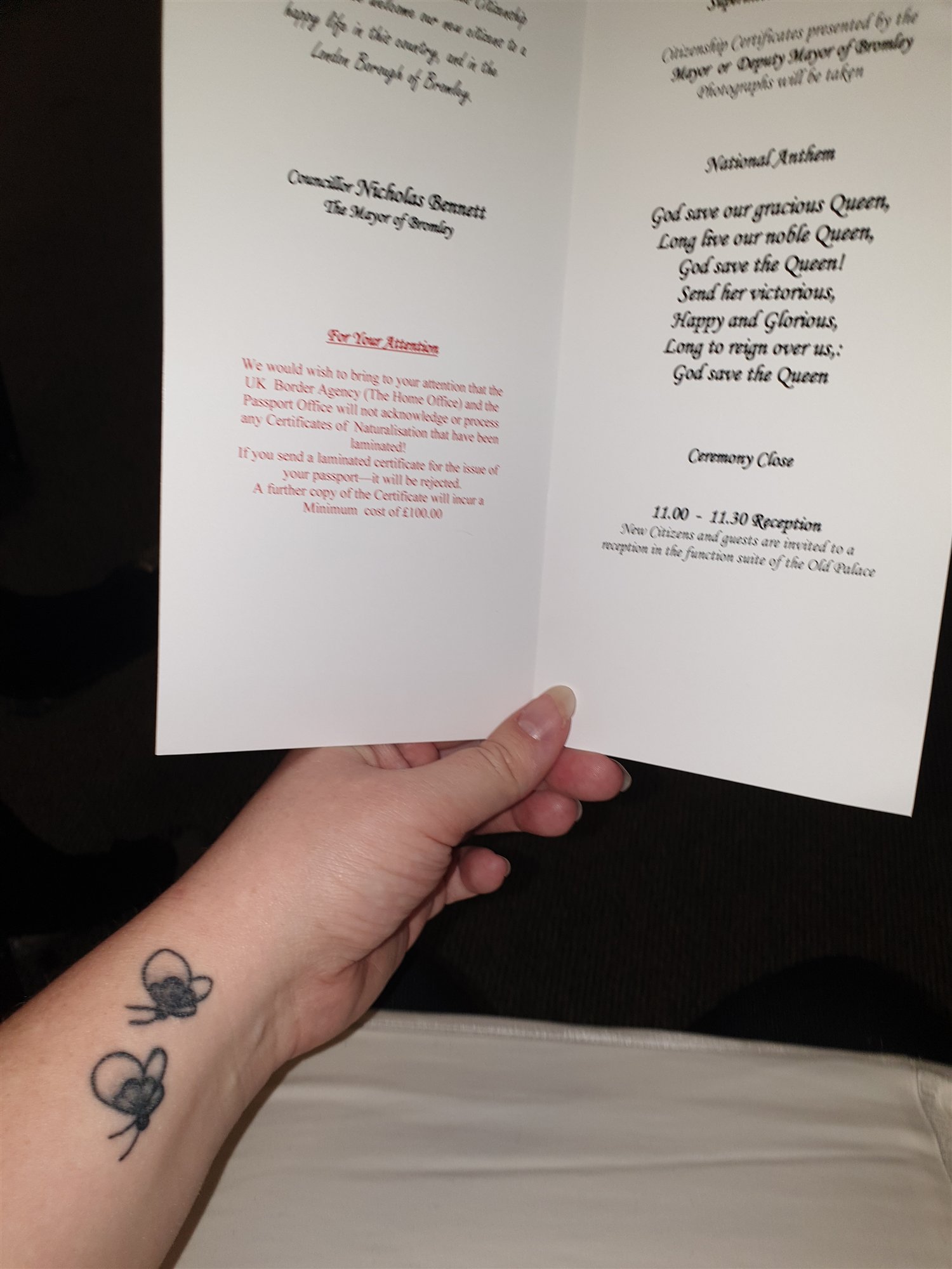 The red warning on the back of the ceremony card: a laminated certificate of naturalisation is rejected by the Passport Office and a replacement cost a minimum of £100 in 2019.