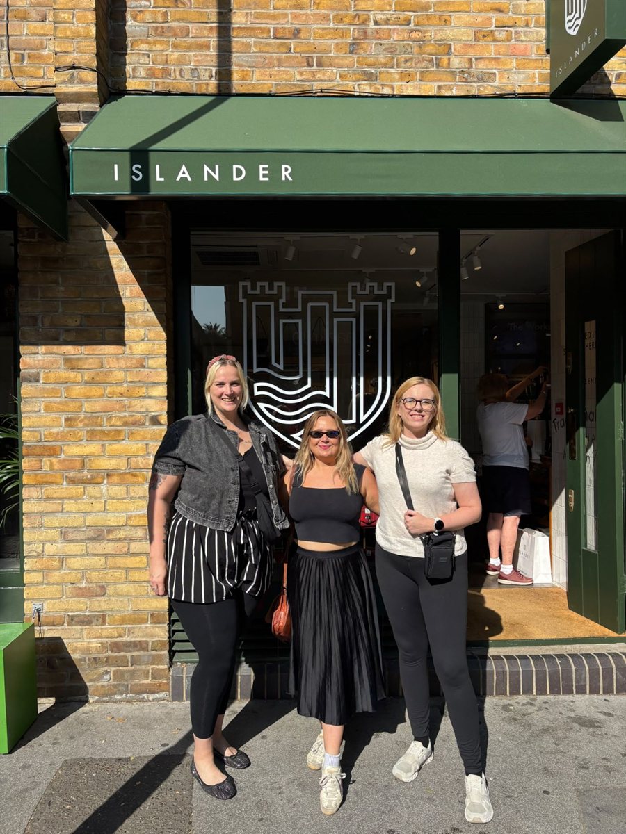 Kat and two friends outside the green Islander shopfront in Covent Garden after the workshop