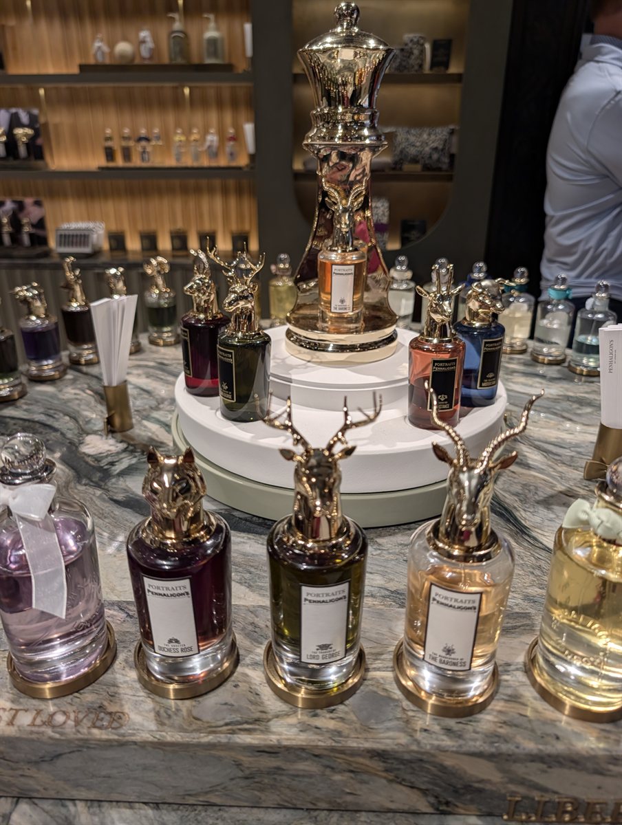Penhaligon's perfume bottles with animal head stoppers on a marble counter at Liberty